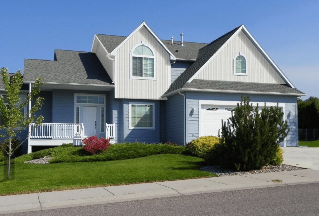 home with blue and white vinyl board and batten