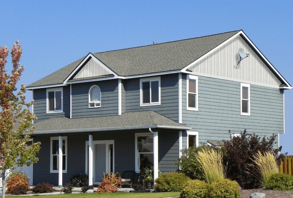 a blue and white home with board and batten siding