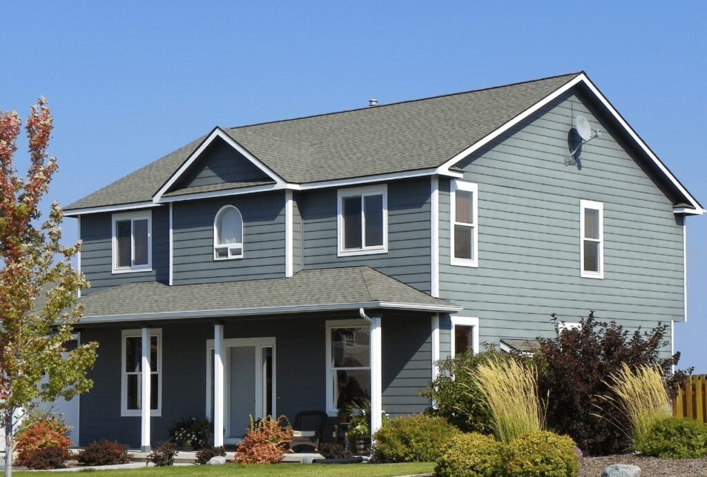 blue home with vinyl siding